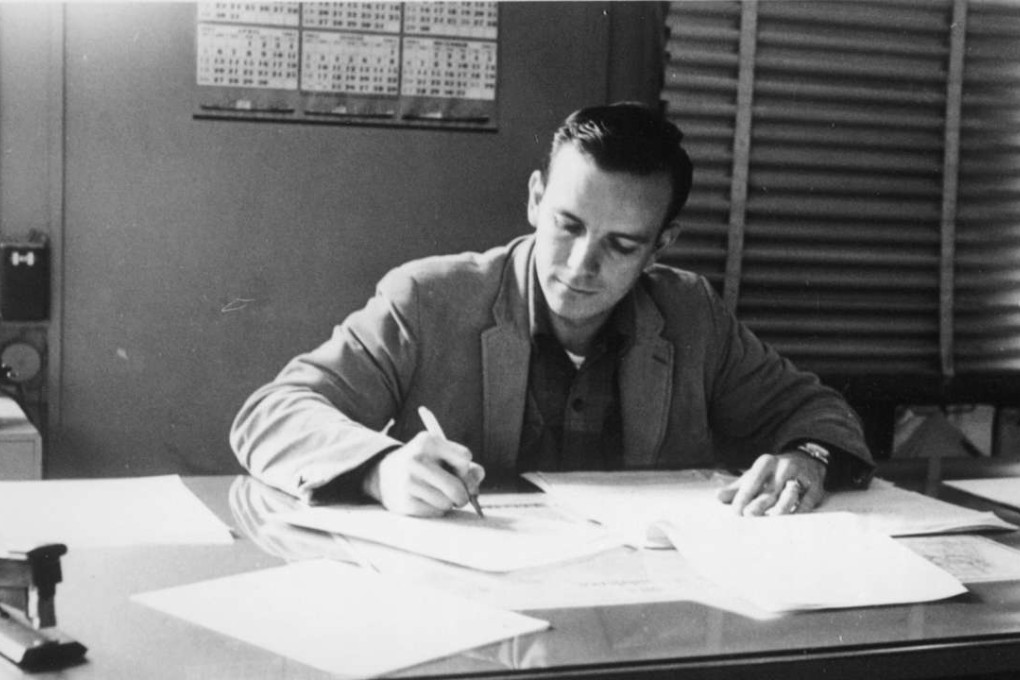 Jim Thompson working at his desk in 1964 at Intercontinental Transport, the company he worked for before starting Transport Services International. Photo: courtesy of Jim Thompson
