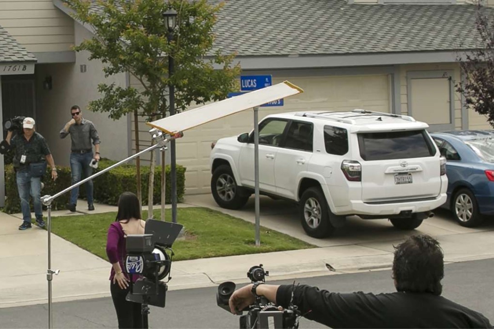 Members of the media stand outside the home of Syed Raheel Farook, the elder brother of San Bernardino gunman Syed Rizwan Farook, after the FBI served a warrant to the location. Photo: AP