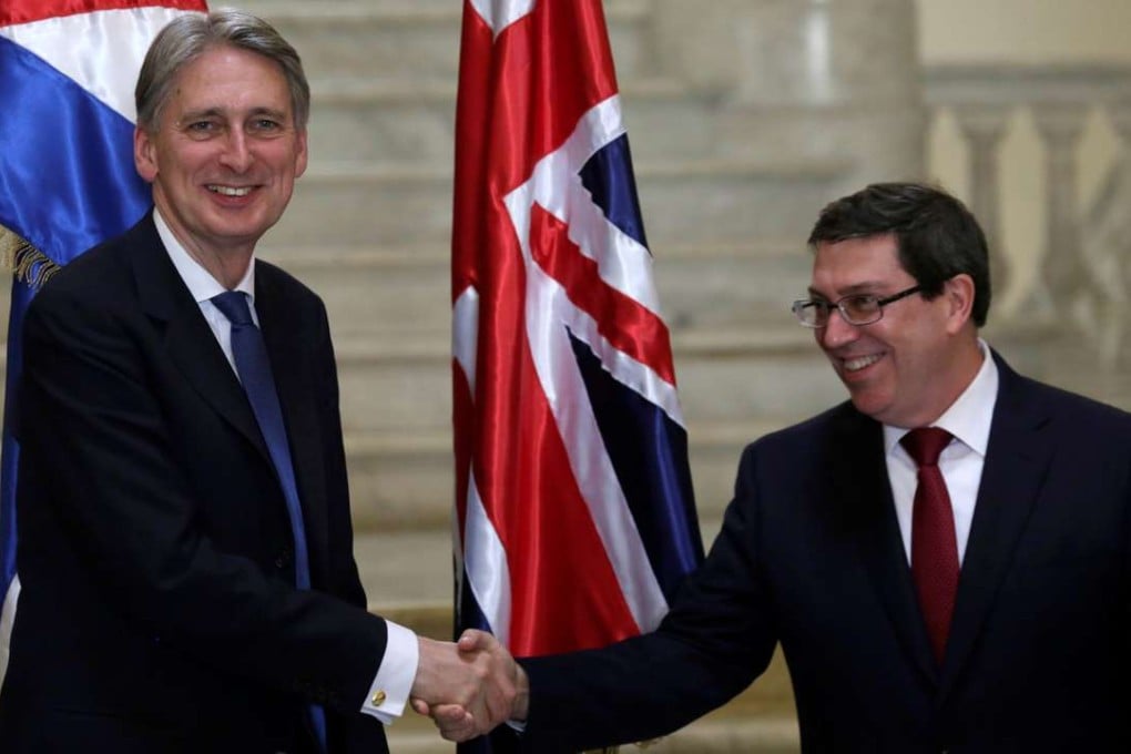 Britain's Foreign Secretary Philip Hammond shakes hands with Cuba's Foreign Minister Bruno Rodriguez Parrilla in Havana. Photo: Reuters