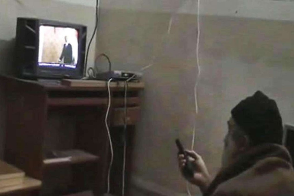 Osama bin Laden, pictured here watching US President Barack Obama on his television, was hunted down and killed by US Navy Seals five years ago. File photo: AP