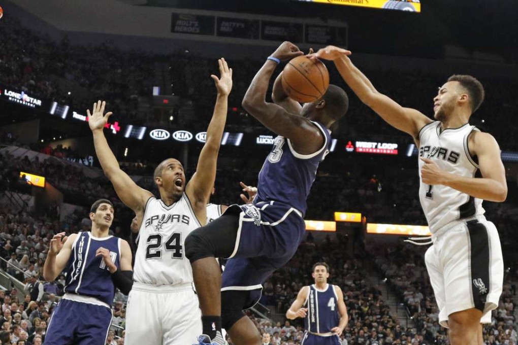 Oklahoma City Thunder’s Dion Waiters has his shot blocked by San Antonio Spurs’ Kyle Anderson. Photo: AFP