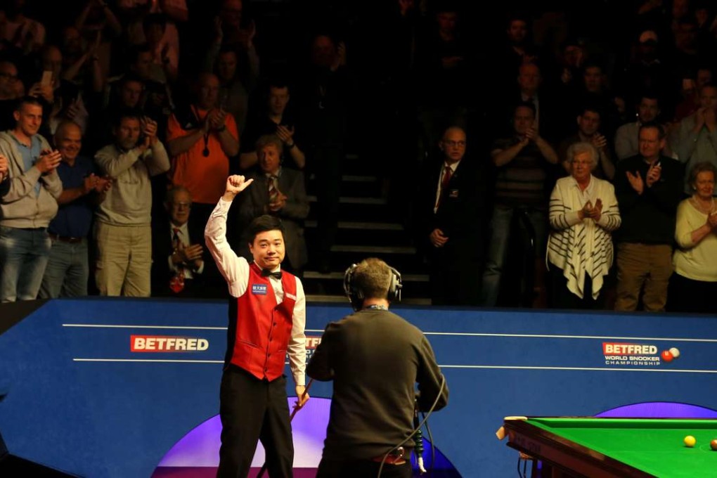 Ding Junhui celebrates after his semi-final win over Alan McManus of Scotland. Photo: Xinhua
