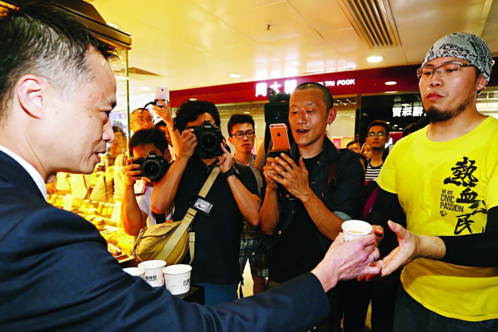 A member of Civic passion walks around shopping mall after cancelled a protest against parallel traders in Sheung Shui. Photo: K. Y. Cheng