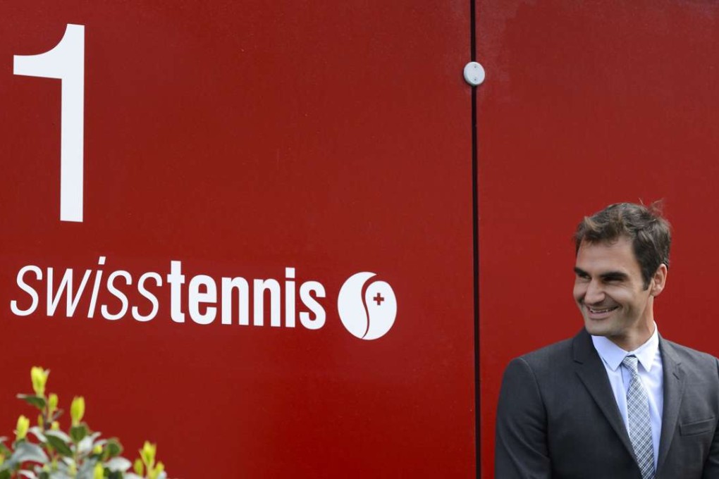 Swiss tennis champion Roger Federer is all smiles during a ceremony marking the inauguration of a street bearing his name on April 21, 2016 in Biel. Photo: AFP