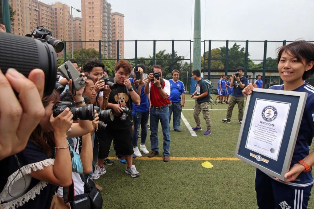 Eastern coach Chan Yuen-ting receives Guinness World Record recognition as the first female football coach to win a top-flight men’s championship. Photo: David Wong