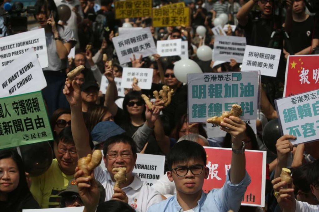 Protesters carried pieces of ginger to symbolise their support for Keung Kwok-yuen, whose surname in Chinese also means ginger. Photo: Sam Tsang