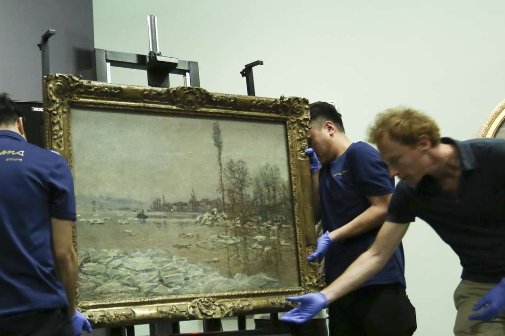 Heritage Museum staff set up the Monet exhibition Claude Monet: The Spirit of Place. Photo: Jonathan Wong