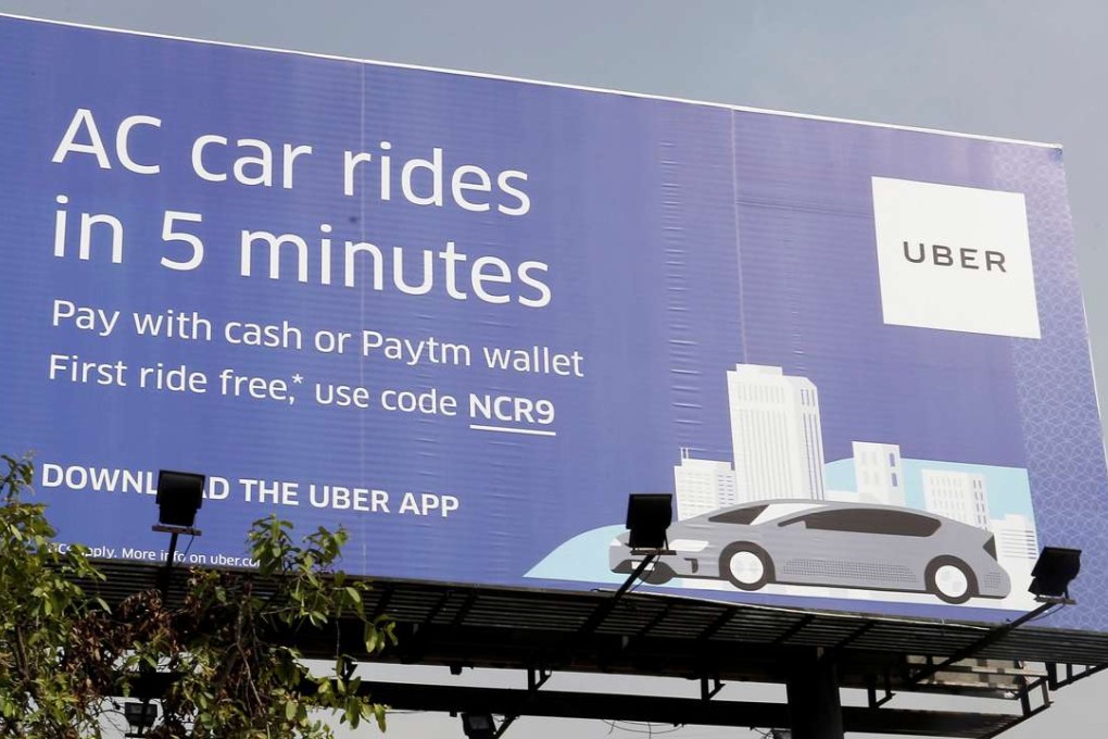 A billboard of ride-hailing service Uber is pictured on a highway in New Delhi, India. Photo: Reuters