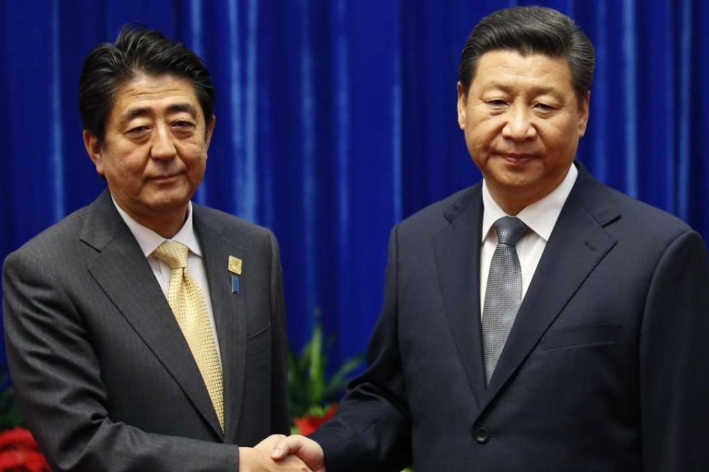 Repeat performance? China's President Xi Jinping (R) shakes hands with Japan's Prime Minister Shinzo Abe in 2014 but more of this is needed to resolve the neighbouring countries’ problems. Photo: Reuters