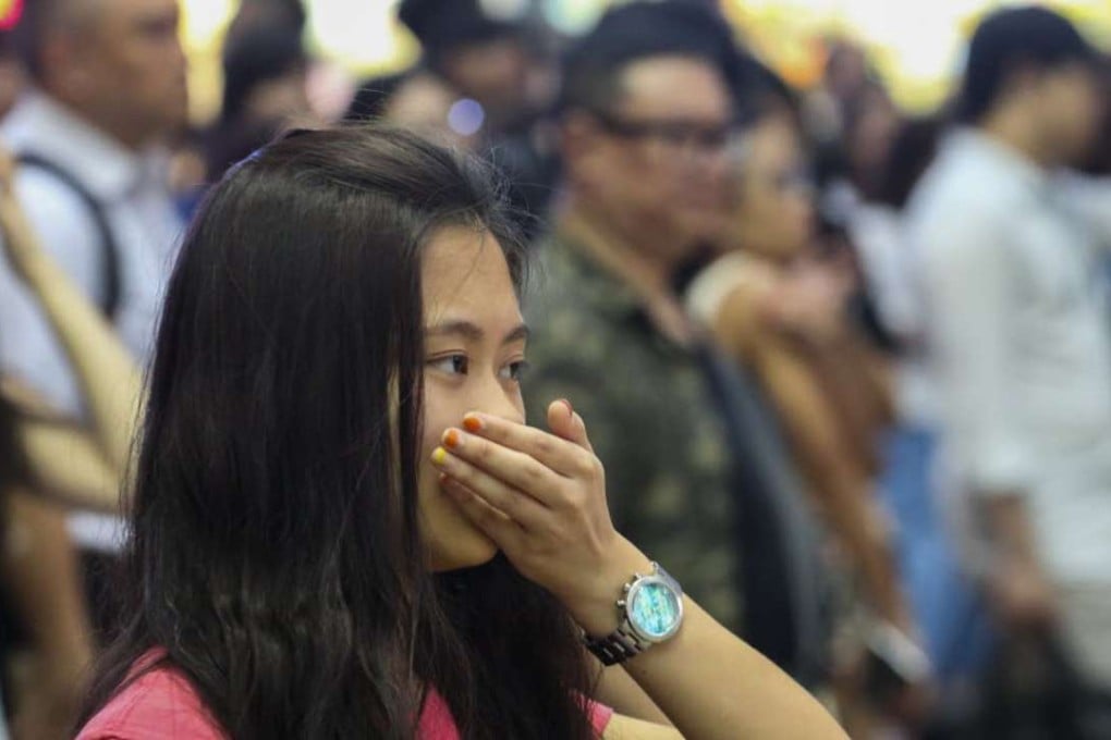 A pedestrian covering her mouth in Causeway Bay in Hong Kong. Photo: SCMP Pictures