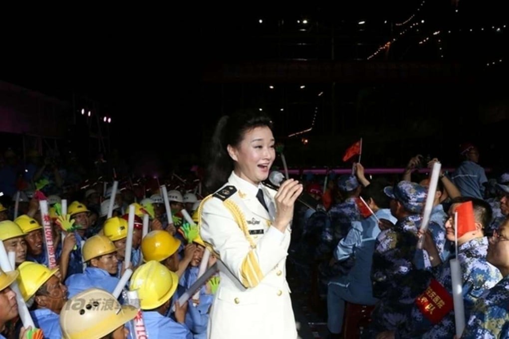 Chinese military folk singer Song Zuying performs for construction workers and military personnel on Fiery Cross Reef on Saturday. Photo: SCMP Pictures