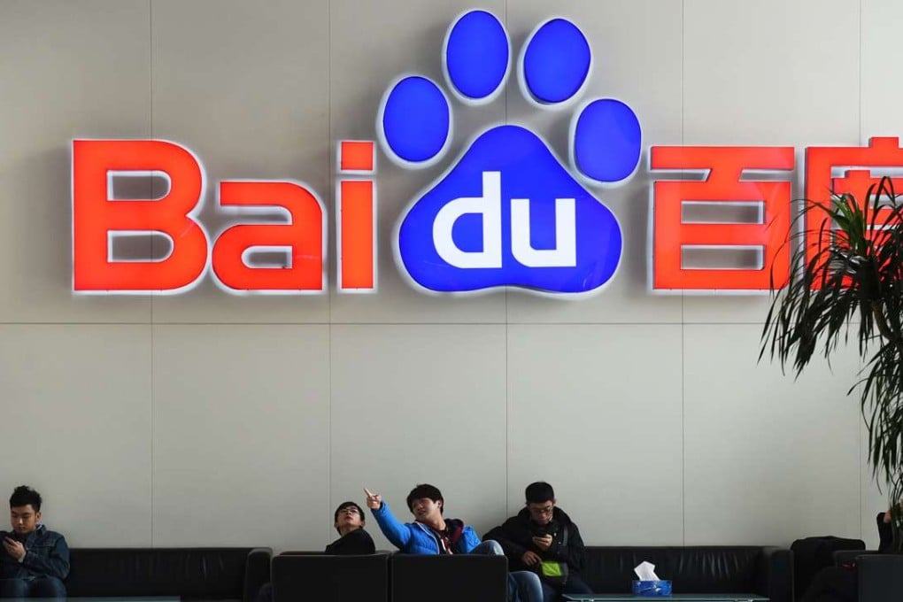 A 2014 file photos shows people sitting below a Baidu logo at the Baidu headquarters in Beijing. Photo: AFP