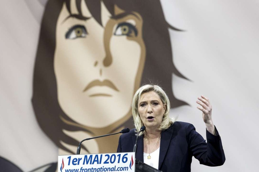 France's far-right National Front leader Marine Le Pen addresses her supporters at a May Day event in Paris. A portrait of Joan of Arc, the party’s patron saint, is seen in the backdrop. Everywhere in Europe, parties of the far right, some eerily reminiscent of fascist organisations of the distantly remembered past, are on the rise. Photo: AP