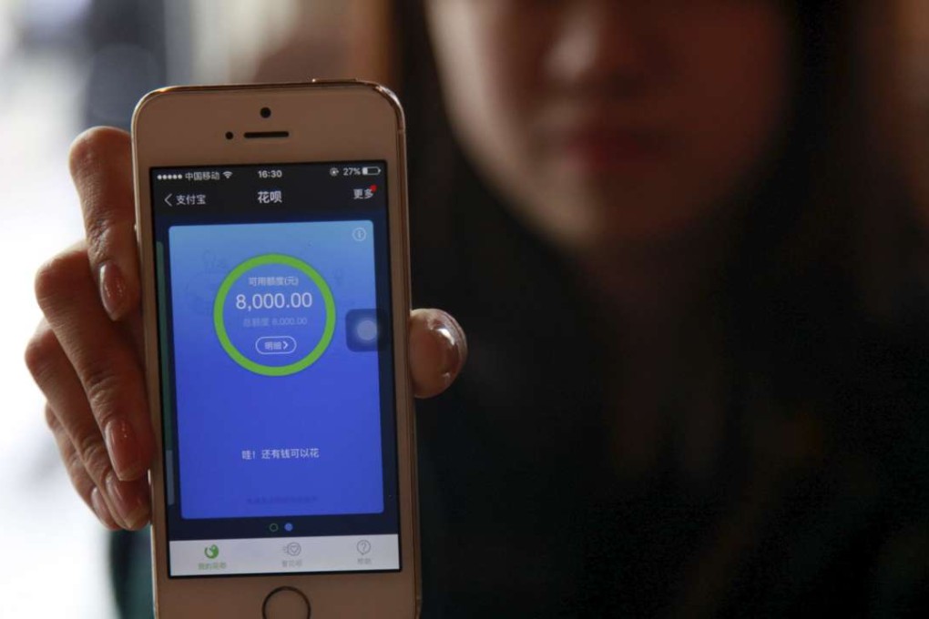 Pang Yu, a 25-year-old railway ticket inspector in Beijing, shows her phone operating Ant Check, an Alibaba-linked platform, at a cafe in Beijing. The screen shows that her available credits with Ant Check is 8000 yuan. Photo Reuters, Shirley Feng