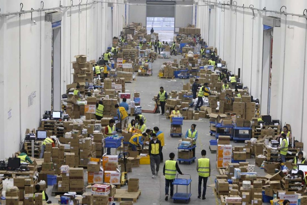 Employees sort boxes and parcels at the logistic centre of a express delivery company. Growth in the services sector eased in April. Photo: Reuters