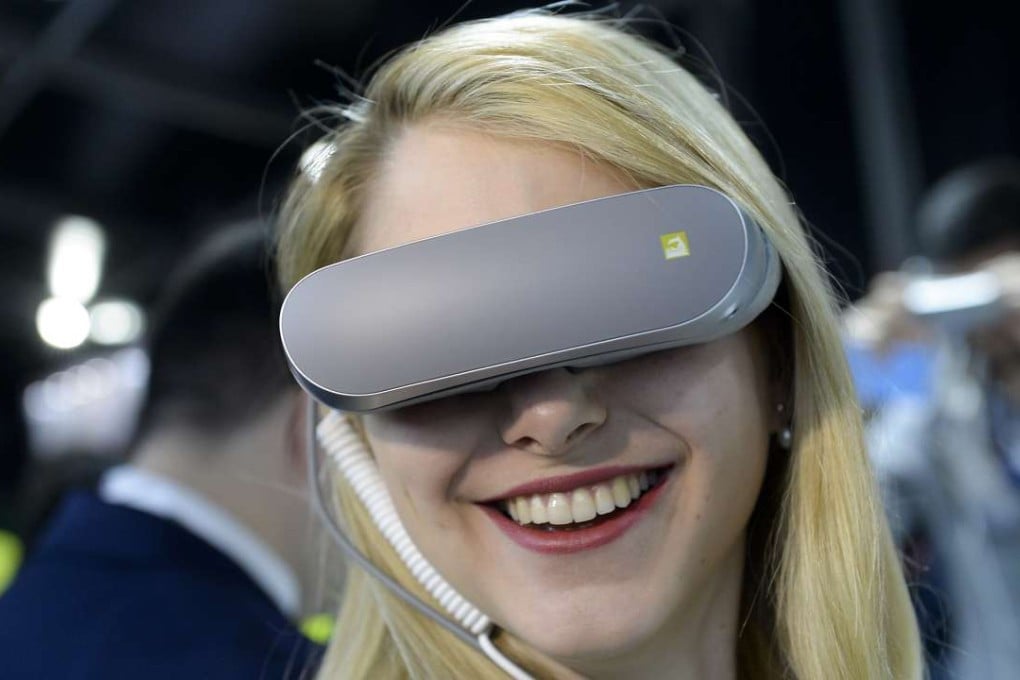 A visitor uses LG’s new 360 VR device at the Mobile World Congress in Barcelona. Photo: AFP