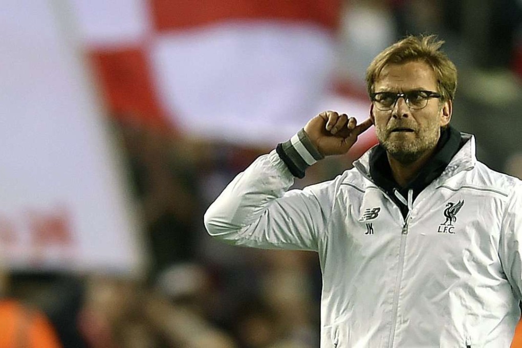 Juergen Klopp celebrates Liverpool's 3-0 victory over Villarreal with the crowd. Photo: EPA