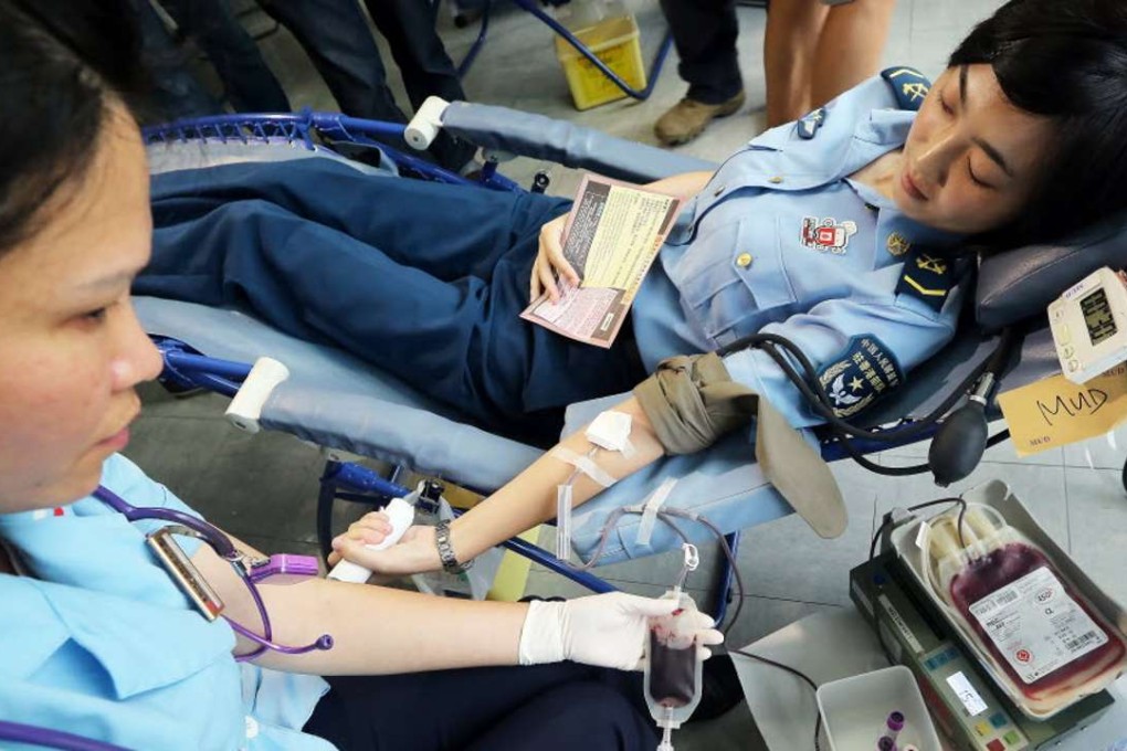 A woman donates blood in Tsim Sha Tsui. Photo: SCMP Pictures