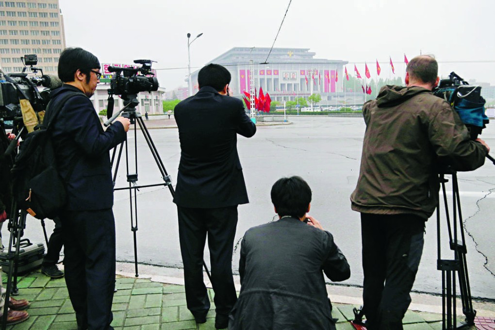 Foreign journalists film outside the House of Culture - the venue for the 7th Congress of the ruling Workers’ Party - before the event. Photo: AP