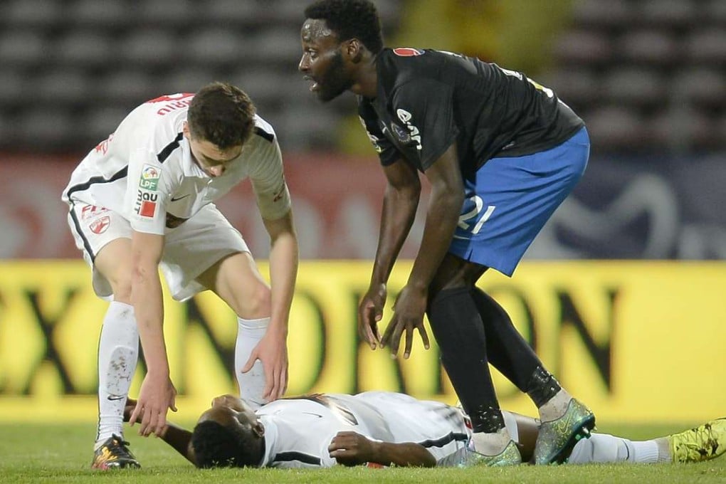 Dinamo's Patrick Ekeng of Cameroon lies on the pitch after collapsing. Photo: AP