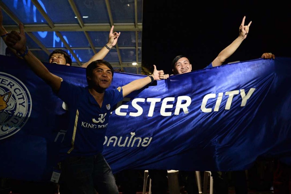 Leicester City fans celebrate during a live screening of the Leicester vs Everton match at King Power headquarters in Bangkok. Photo: AFP