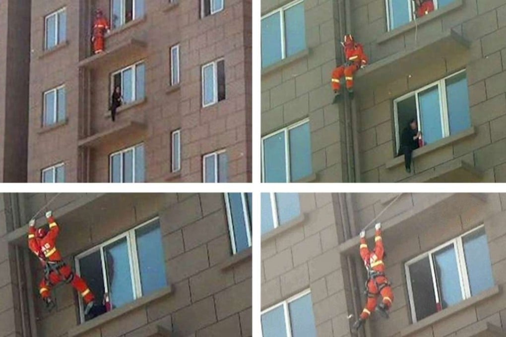 Emergency rescue officers make the dramatic rescue in Xuzhou, Jiangsu province. Photo: SCMP Pictures