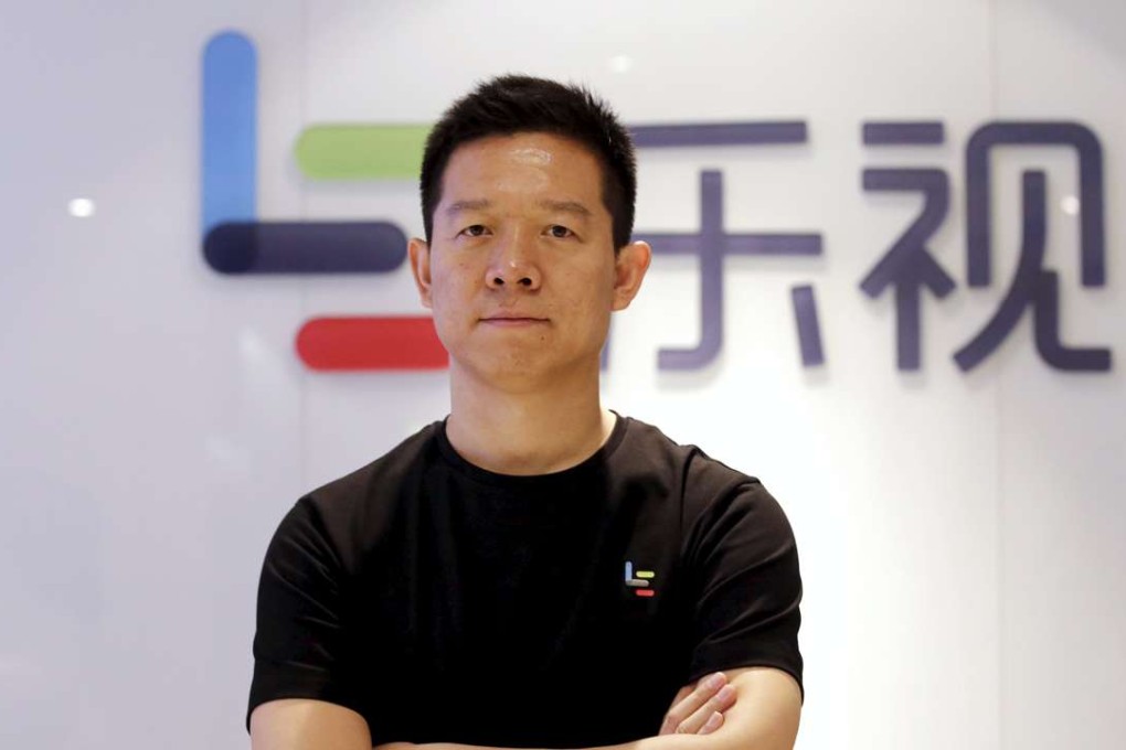Jia Yueting, co-founder and head of Le Holdings Co, also known as LeEco and formerly as LeTV, poses for a photo in front of a logo of his company after a Reuters interview at LeEco headquarters in Beijing on April 22, 2016. Photo: Reuters