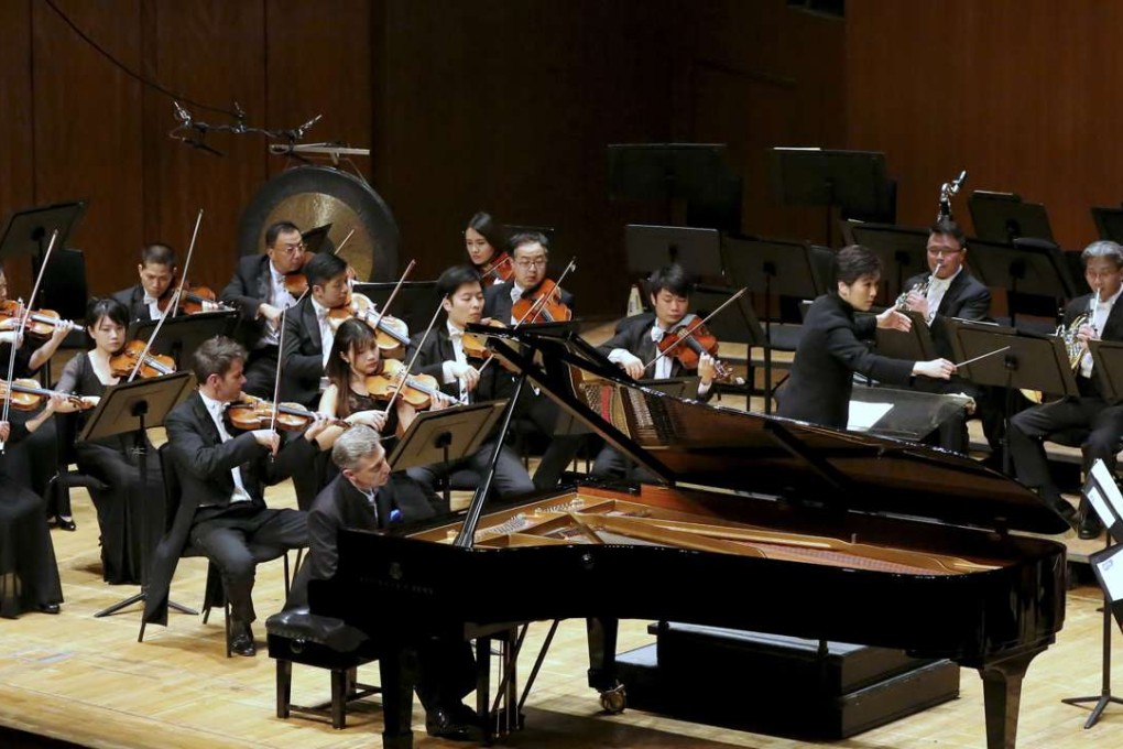 Yip Wing-sie conducts the Hong Kong Sinfonietta with soloist Michel Dalberto at City Hall Concert Hall. Photo: Courtesy of the Hong Kong Sinfonietta