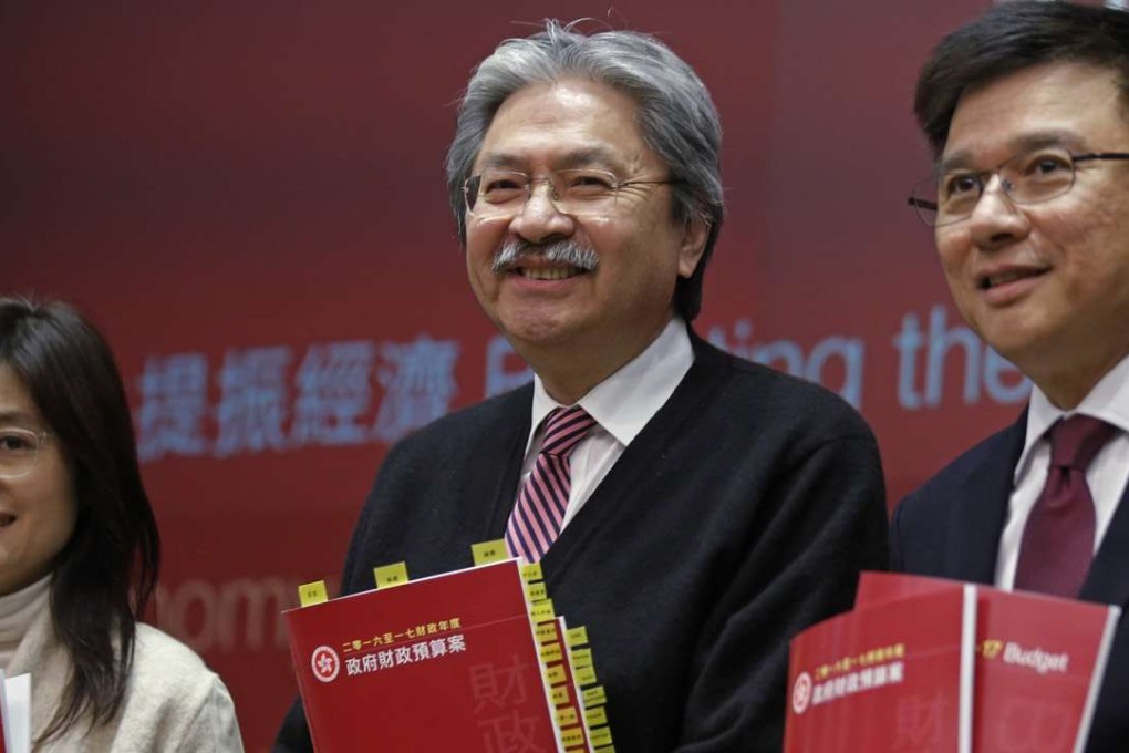Hong Kong Financial Secretary John Tsang (centre) during a news conference after delivering his budget speech in Hong Kong. Photo: AP