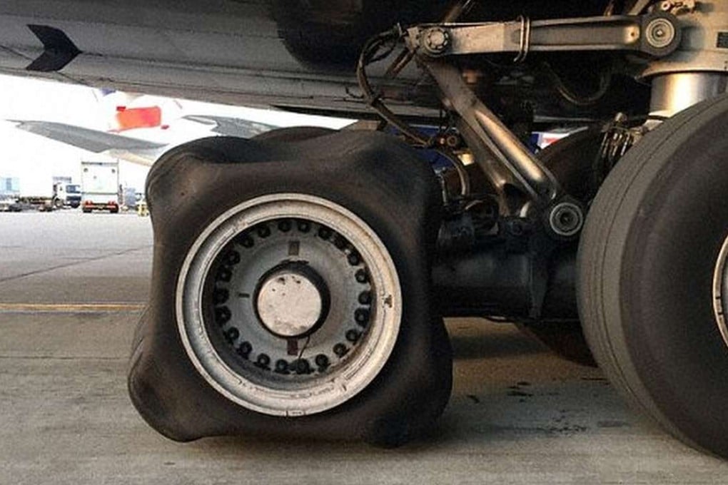A square-shaped tyre on a British Airways A380 that touched down at London's Heathrow Airport. The captain of the Airbus A380-800 received a loss of tyre pressure warning on take-off during the flight from Hong Kong to London Heathrow. Aviation experts have been left baffled by the misshapen deflated wheel, which was part of the landing gear on a flight that arrived from Hong Kong on Friday. SCMP Pictures (from Daily Mail)