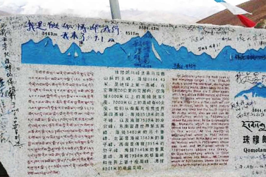 Tourists’ graffiti are seen on the monument at Mount Everest scenic zone. Photo: SCMP Pictures