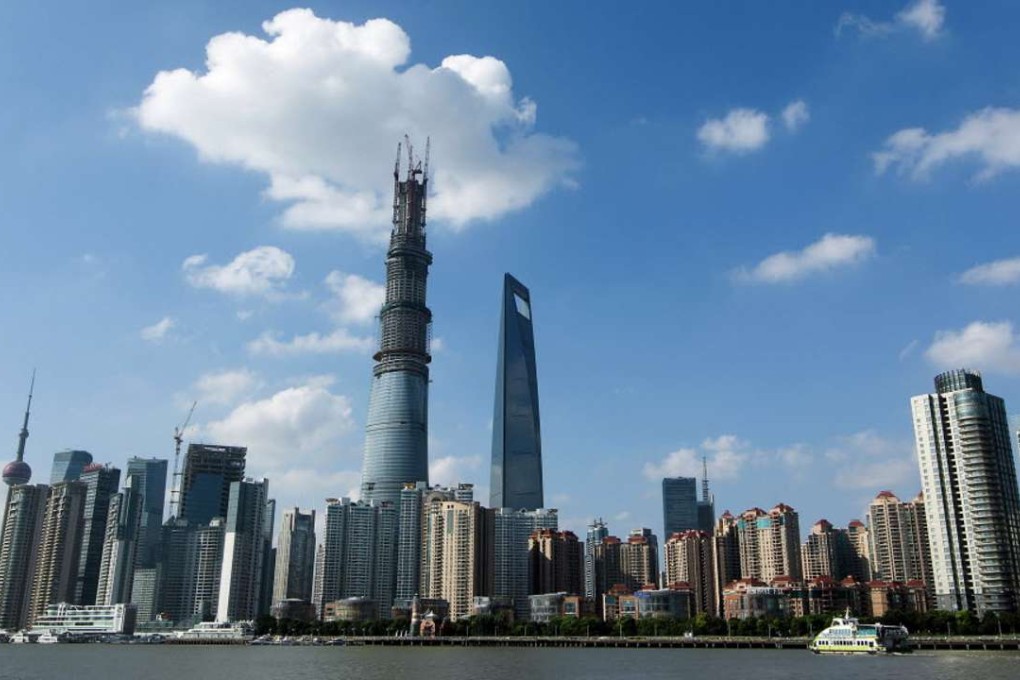 The 632-metre Shanghai Tower (centre) under construction. Photo: AFP