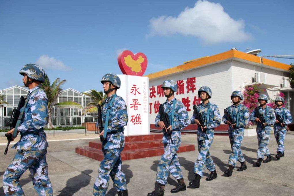 China's People's Liberation Army personnel at Fiery Cross Reef in the Spratly Islands. Photo: Reuters