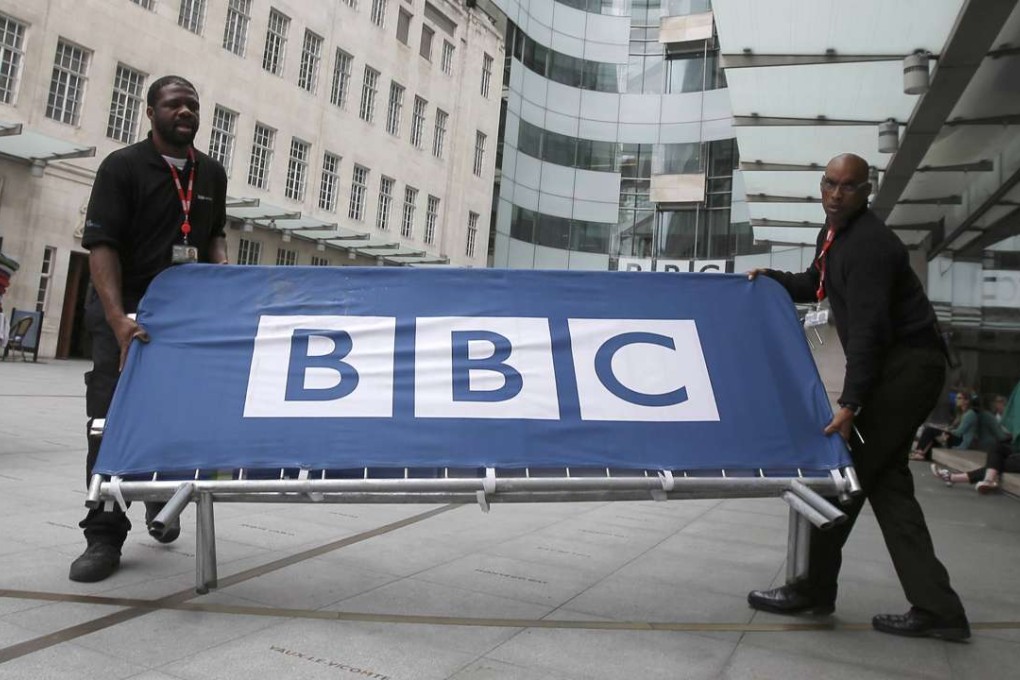 BBC workers place barriers near the main entrance of the BBC headquarters. Photo: Reuters