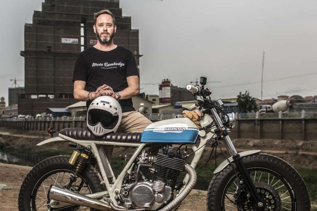 Justin Stewart, the Australian co-founder of Moto Cambodge, with the custom beach/surf tracker he designed and built from a 2001 Yamaha SR400. Photo: Charles Fox