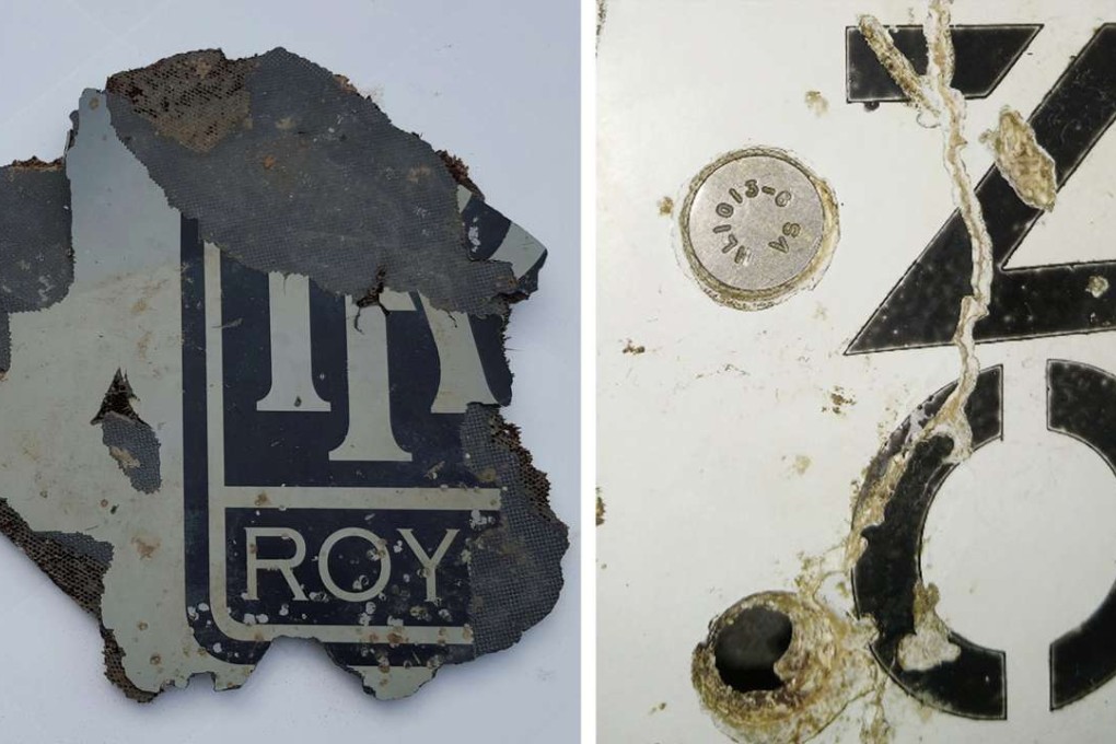 Part of a plane debris found in Mossel Bay, near Cape Town, South Africa; and an undated handout picture made available by the Australian Transport Safety Bureau (ATSB) of the detail of a piece of metal found on a beach in Mozambique (right). Photo: EPA