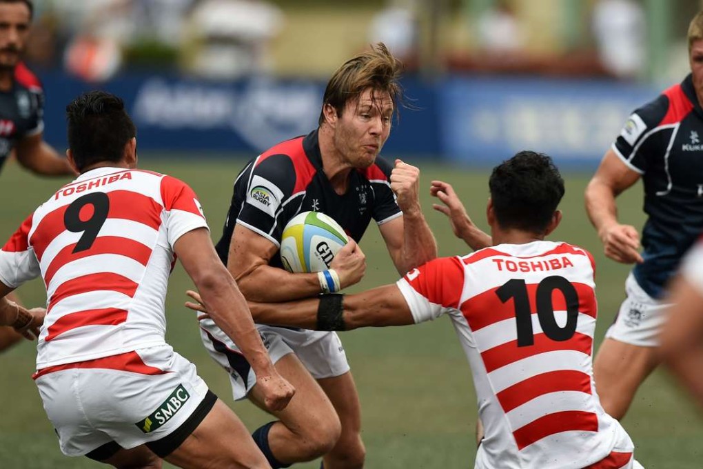 Ryan Meacheam tries to break through the Japan defence during last weekend’s 38-3 defeat at Hong Kong Football Club. Photos: AFP