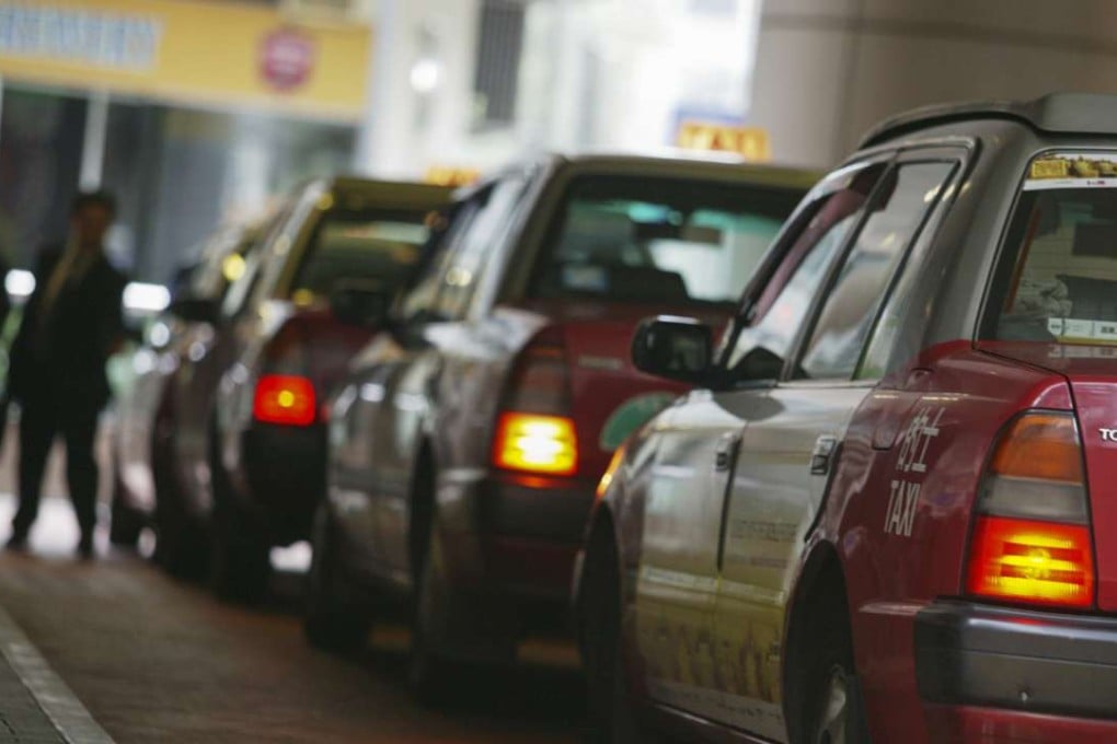 Taxis are lined up at Taikoo Place, Hong Kong, waiting for customers. 02 November 2007