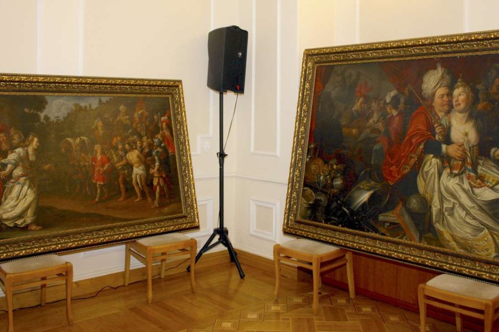 Paintings stolen from a museum in Verona, Italy, are seen on display during a news conference at Ukraine’s Security Service headquarters in Kiev. Photo: Reuters