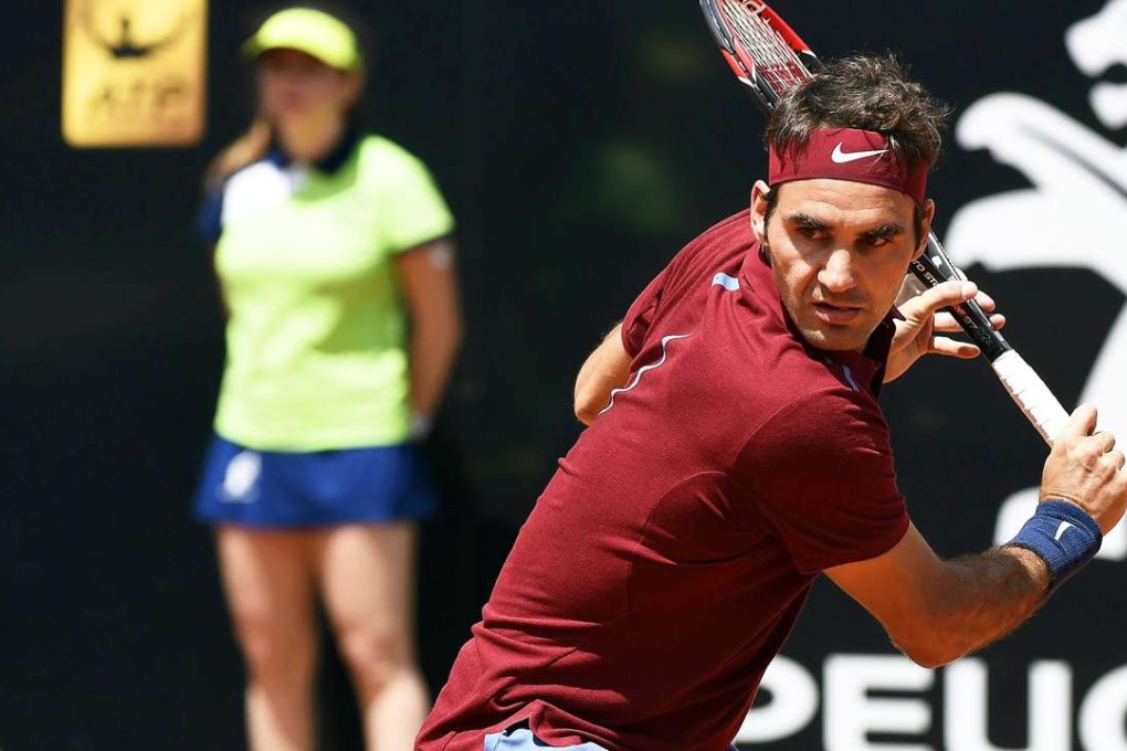 Switzerland’s Roger Federer returns the ball to Austria’s Dominic Thiem during their third round match at the Foro Italico in Rome. Photo: EPA