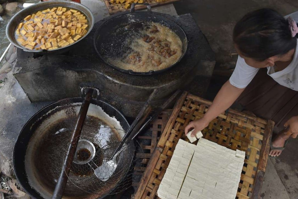 Innovative villagers on Java island are producing something extra from the simple soybean cake – cheap, renewable energy, piped directly into their homes. Photo: AFP