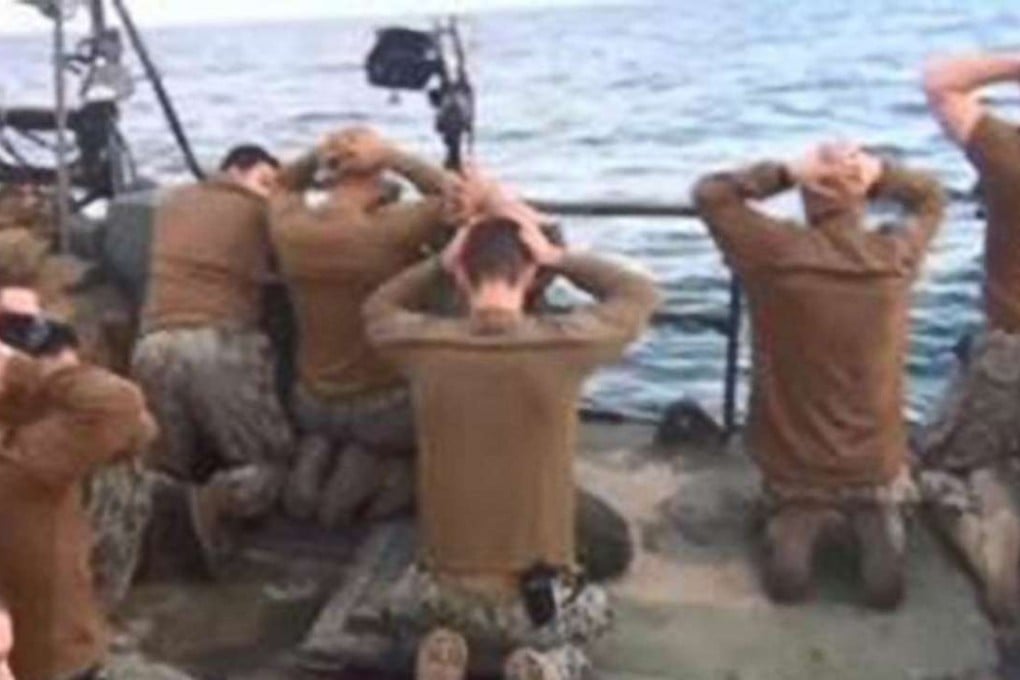The US sailors kneel in front of the Iranian Revolutionary Guards captors on the waters of the Persian Gulf on January 13. Photo: Sepah News