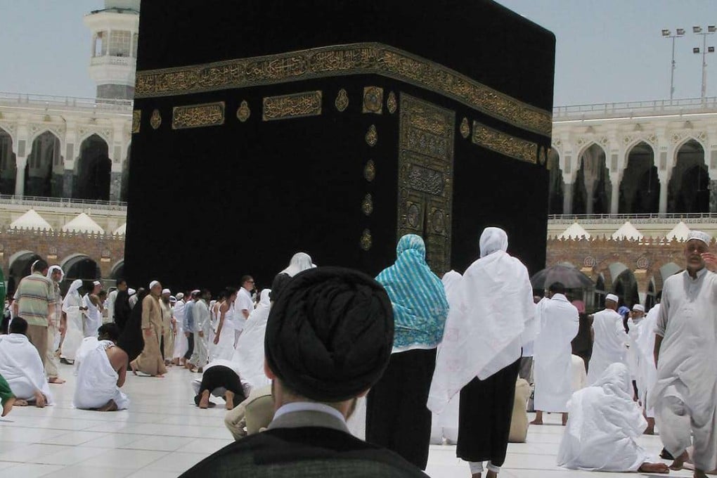 This file photo takenin 2008 shows an Iranian Shiite Muslim pilgrim praying in front of the Kaaba inside Mecca's Grand Mosque, Islam's holiest shrine. Photo: AFP