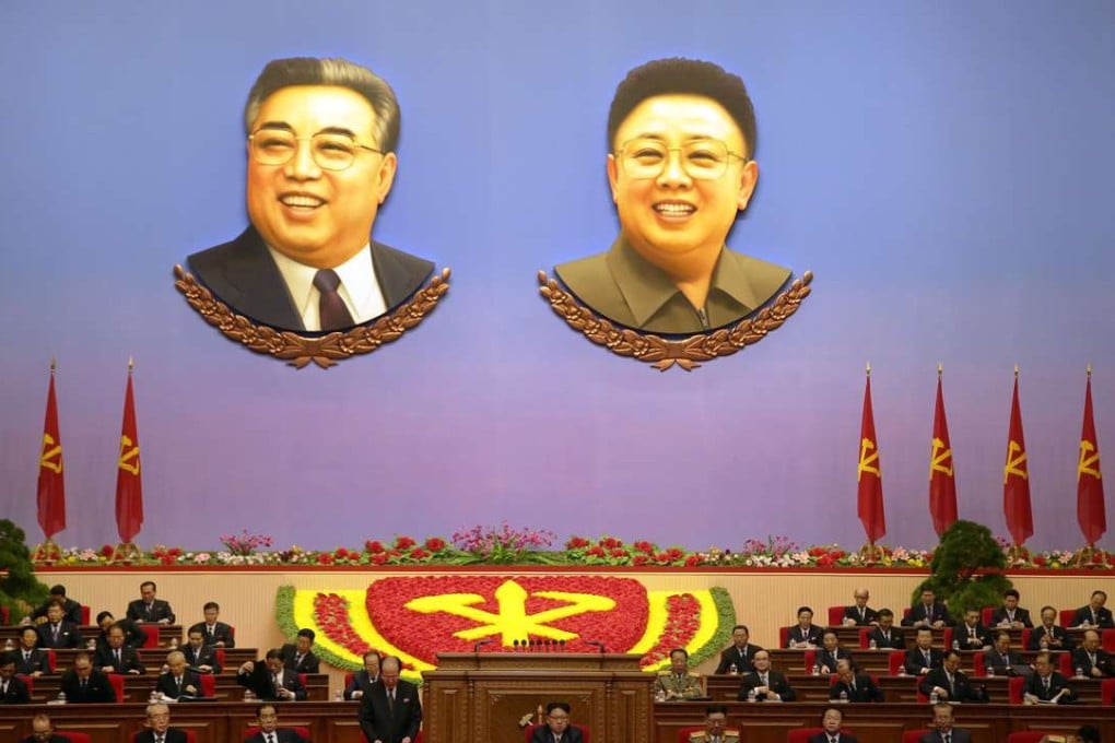 The portraits of Kim Il-sung (left) and Kim Jong-il hang inside the convention hall where the party congress was held this month. Photo: AP