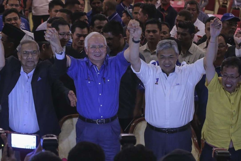 Malaysia Prime Minister Najib Razak (second left) celebrates after the Sarawak state election. Photo: EPA