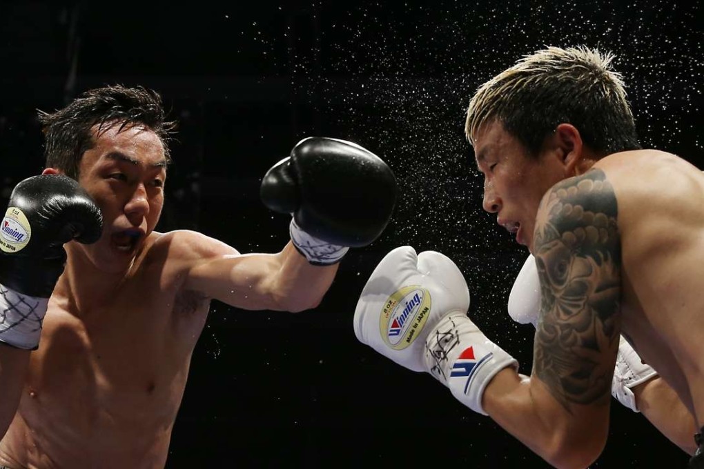 Rex Tso gives it all he’s got against Young Gil-bae, who is no match for the “Wonder Kid”. Photos: SCMP/Sam Tsang
