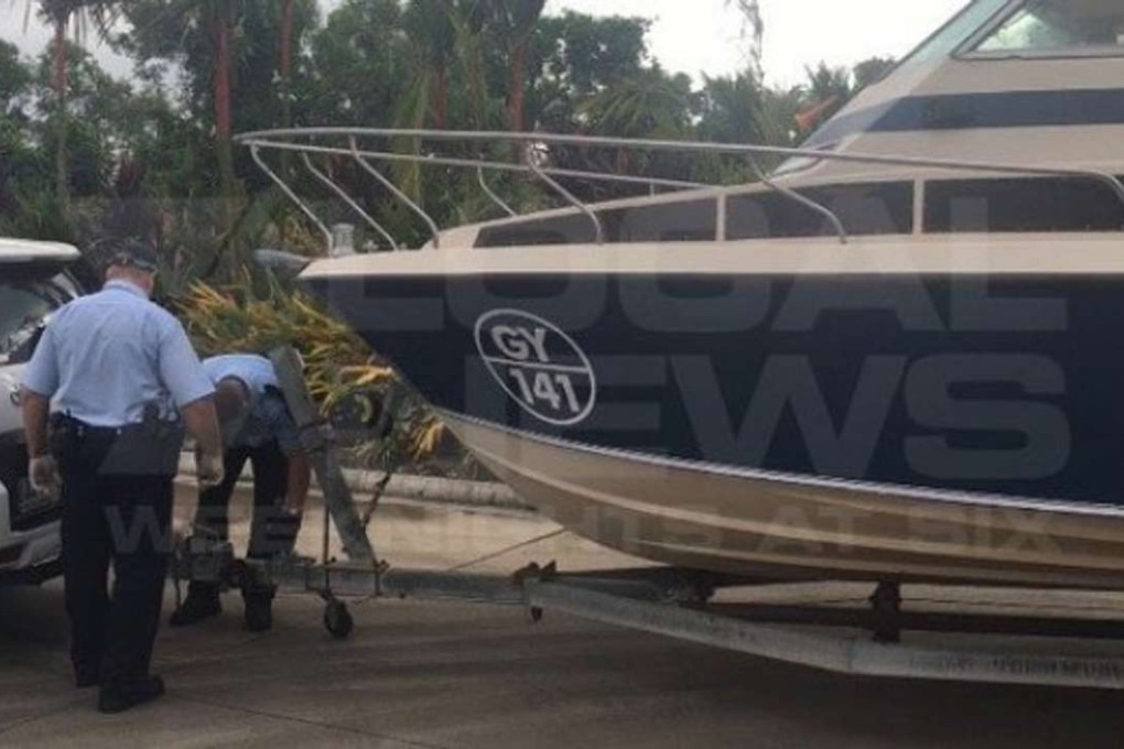 Police in Queensland inspect the boat the men had driven 2,840 kilometres from Melbourne to Cairns where they planned to set sail to Indonesia. Photo: Channel 7