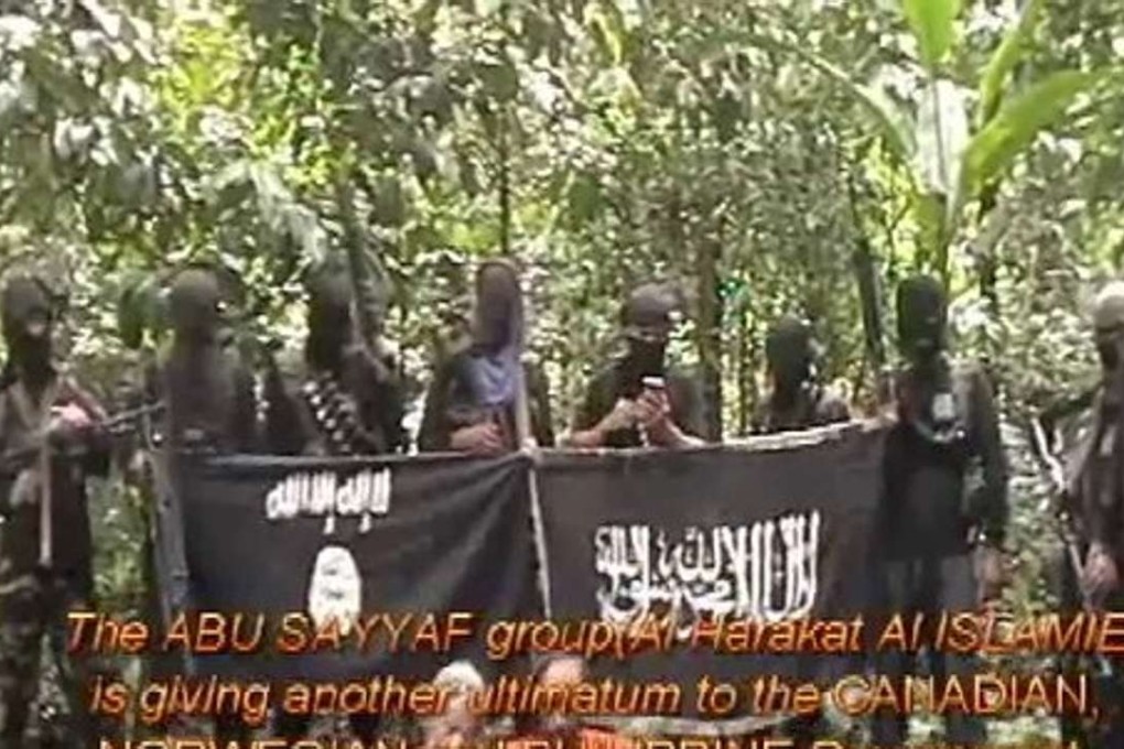 An English statement superimposed on the video says that “if our RANSOM Demand worth 6 hundred million pesos is not given. We will behead another Foreign Hostage on JUNE 13 (Monday) at exactly 3 p.m.” Photo: SITE