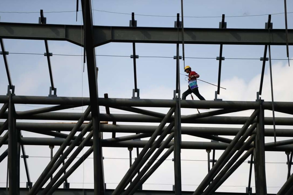 A worker at the construction site of the Lanzhou West Railway Station in Lanzhou, capital of northwest China's Gansu province. Photo: Xinhua
