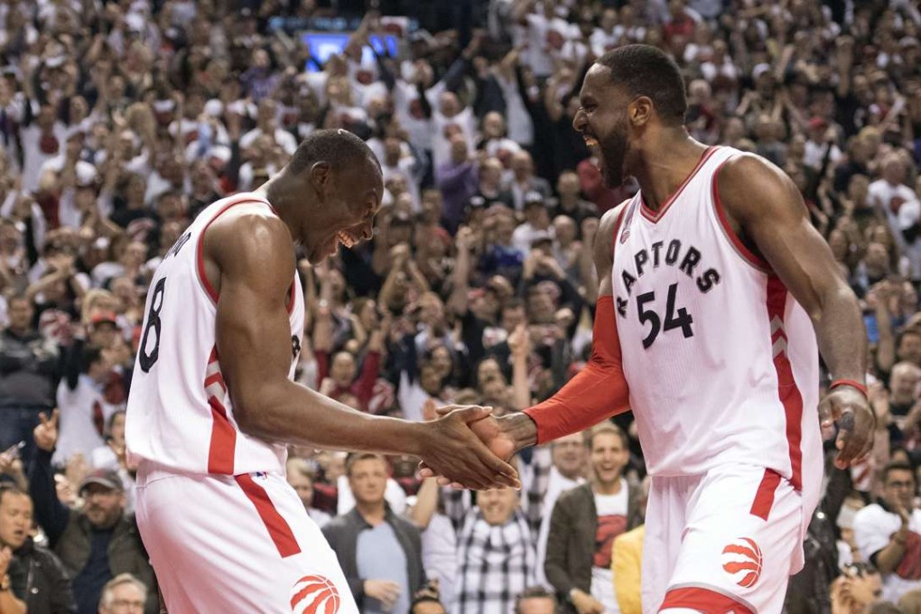 Toronto Raptors centre Bismack Biyombo celebrates scoring with forward Patrick Patterson during the fourth quarter of game seven. Photo: USA Today